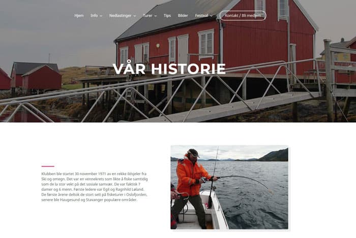 A person in an orange jacket fishes from a boat in front of red wooden buildings by the water, with Norwegian text about the club’s history on the website.